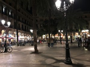 Nighttime view of one of the lampposts created by Gaudí Barcelona's Plaça Reial