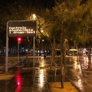 Rainy night on Placa de la universitat