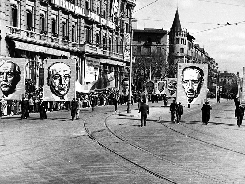 1937 - Popular army parading near Plaça de Catalunya with poster of Lluís Companys.
