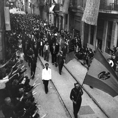 Parade of victorious rebel soldiers down the streets of barcelona after the Spanish Civil War.